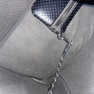 Black ah•dorned purse